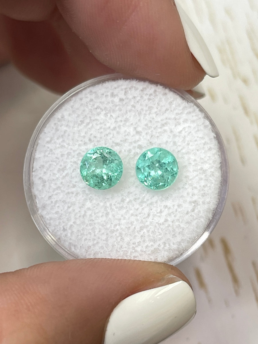 A Pair of 1.85 Total Carat Weight 6x6 Round Colombian Emeralds in Delicate Green