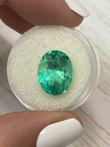 Stunning 6.86 Carat Oval Cut Colombian Emerald in Medium Spring Green