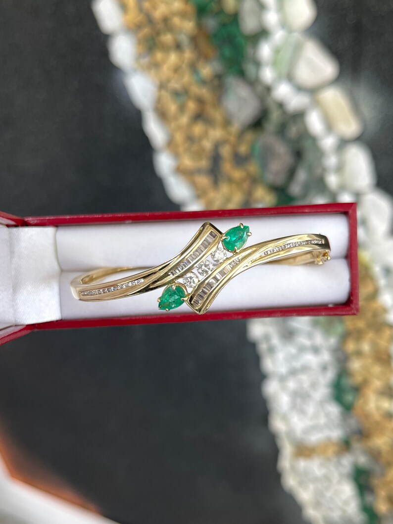 14K yellowish green emerald bangle bracelet with round cut emeralds and triple diamond accents, Colombian Emerald jewelry.