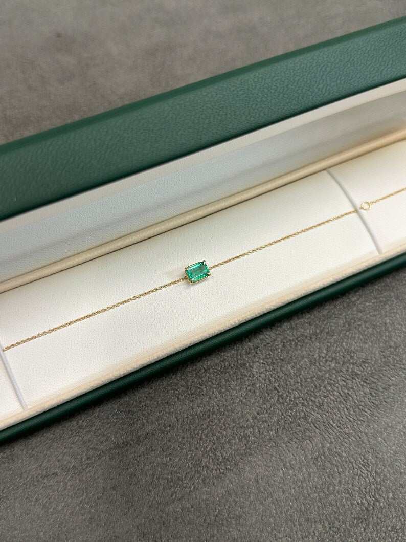 Colombian Emerald 1.0 Carat rich green natural emerald claw prong solitaire bracelet in 14K gold.