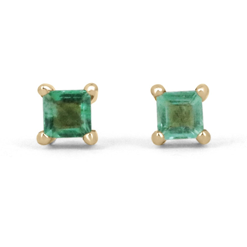Pair of 14K gold Colombian Emerald earrings featuring petite baby princess-Asscher cut emeralds totaling 0.45 carats.