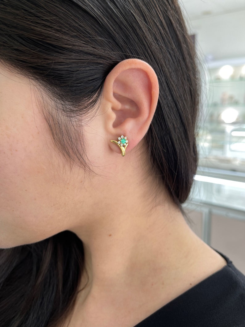 Spring green emerald and diamond floral halo earrings in 18K gold by Colombian Emerald, featuring 0.71tcw natural gemstones.