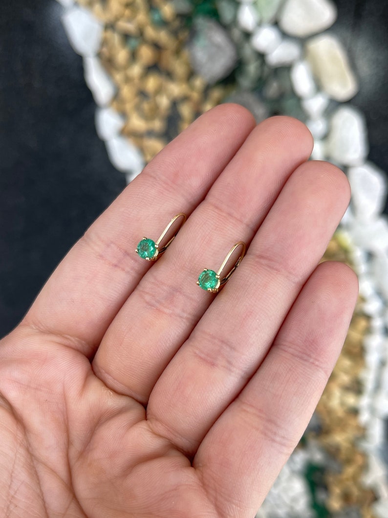 14K yellow gold round emerald leverback earrings with 0.80tcw Colombian emeralds, showcasing vibrant green gemstones and gold settings.