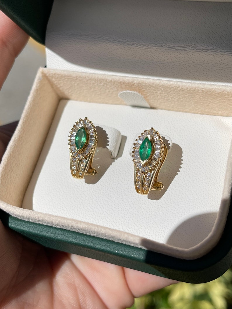 Natural dark green emerald and diamond accent lever back earrings in 14K gold, featuring Colombian emeralds and elegant design.