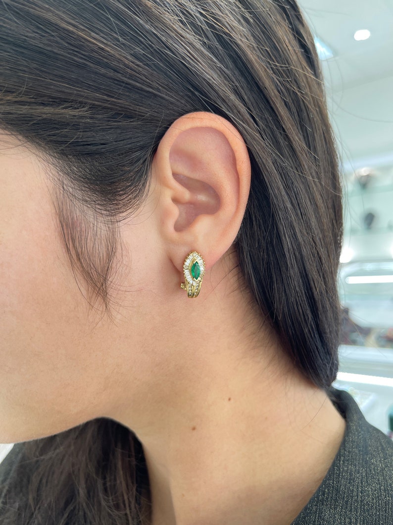 Natural dark green emerald lever back earrings with diamond accents in 14K gold, showcasing elegant jewelry design.