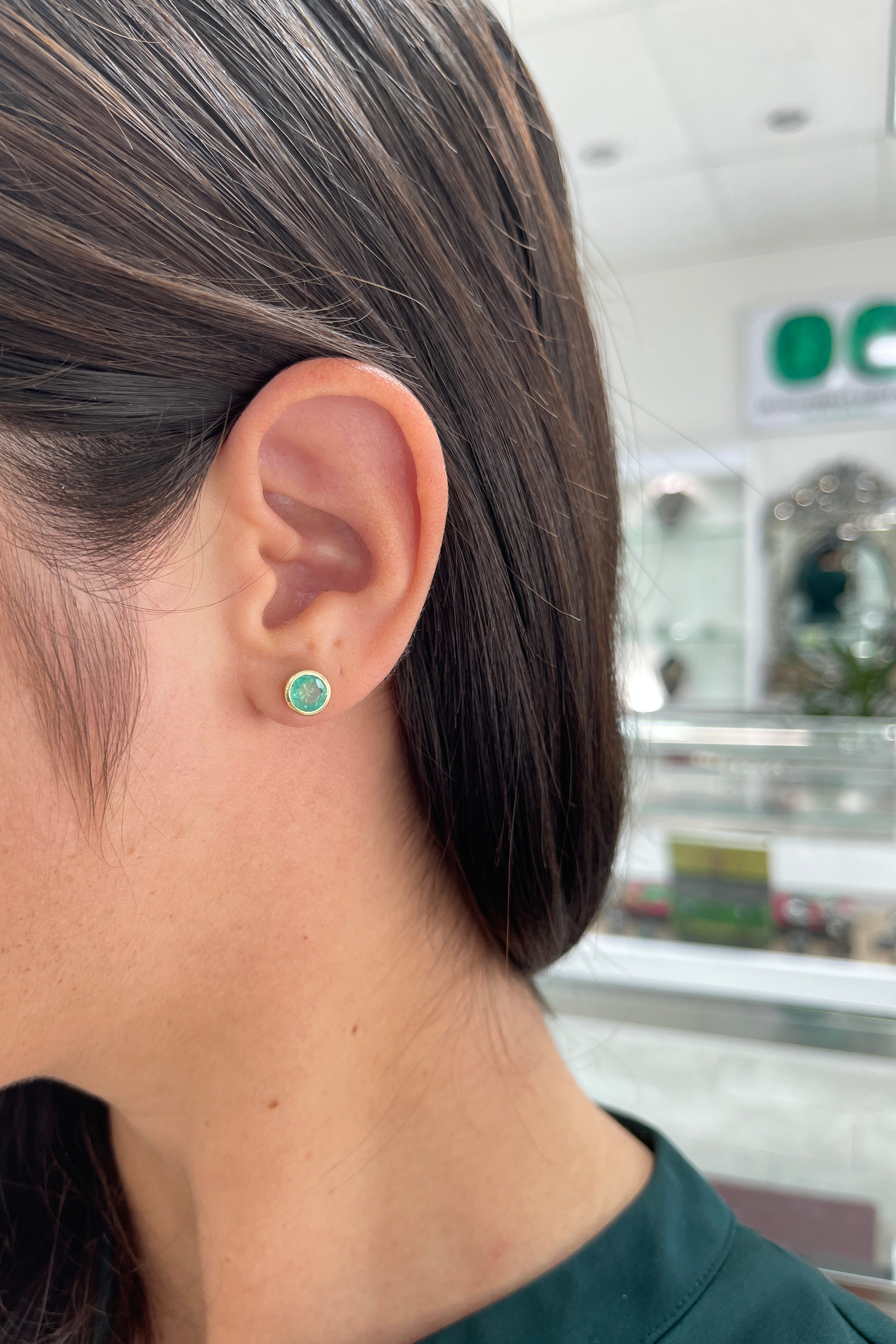 14K gold natural emerald round cut push back earrings with 1.60tcw from Colombian Emerald, showcasing vibrant green gemstones.