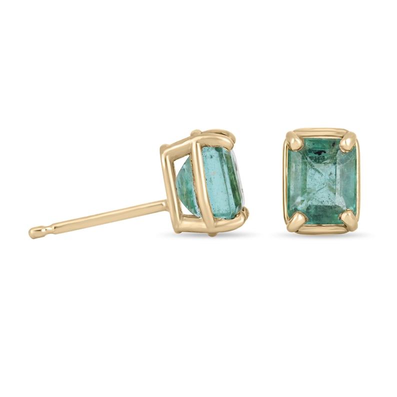 Colombian Emerald 1.85tcw 14K gold natural emerald cut May birthstone stud earrings on a white background.