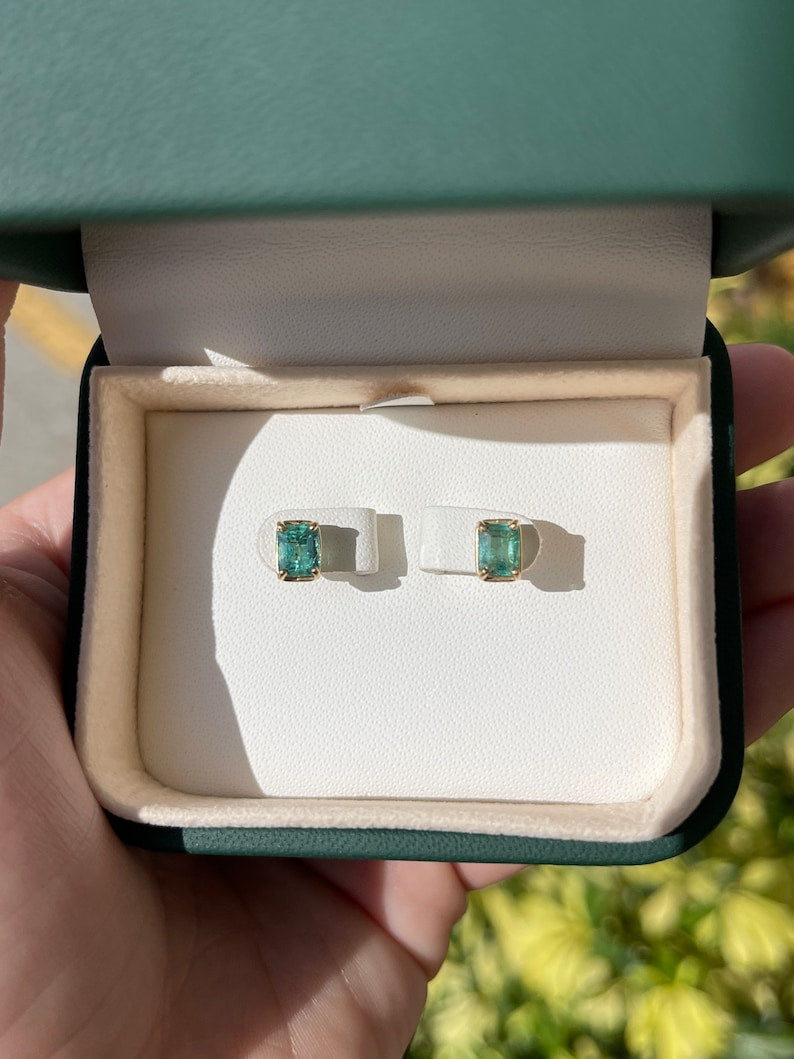 14K gold May birthstone stud earrings with natural emerald cut emeralds from Colombian Emerald, featuring 1.85 carats total weight.