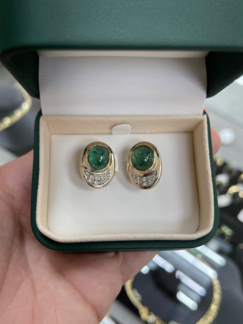 Colombian Emerald and diamond accent 14K yellow gold clip-on earrings with 10.14tcw emerald cabochons and elegant design