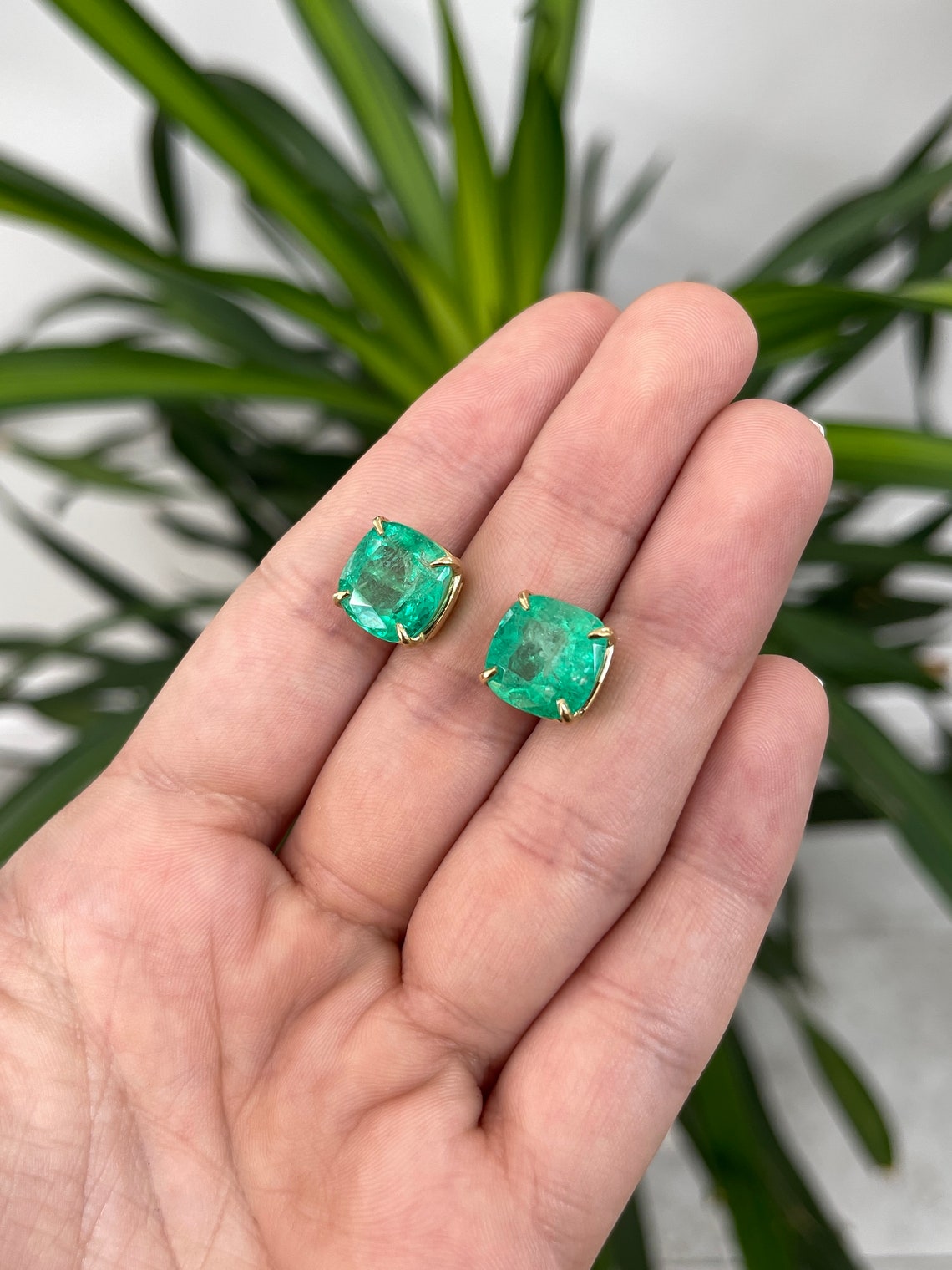 Colombian Emerald earrings with 11.80tcw AAA cushion-cut emeralds in 18K setting, featuring four-claw prong design.
