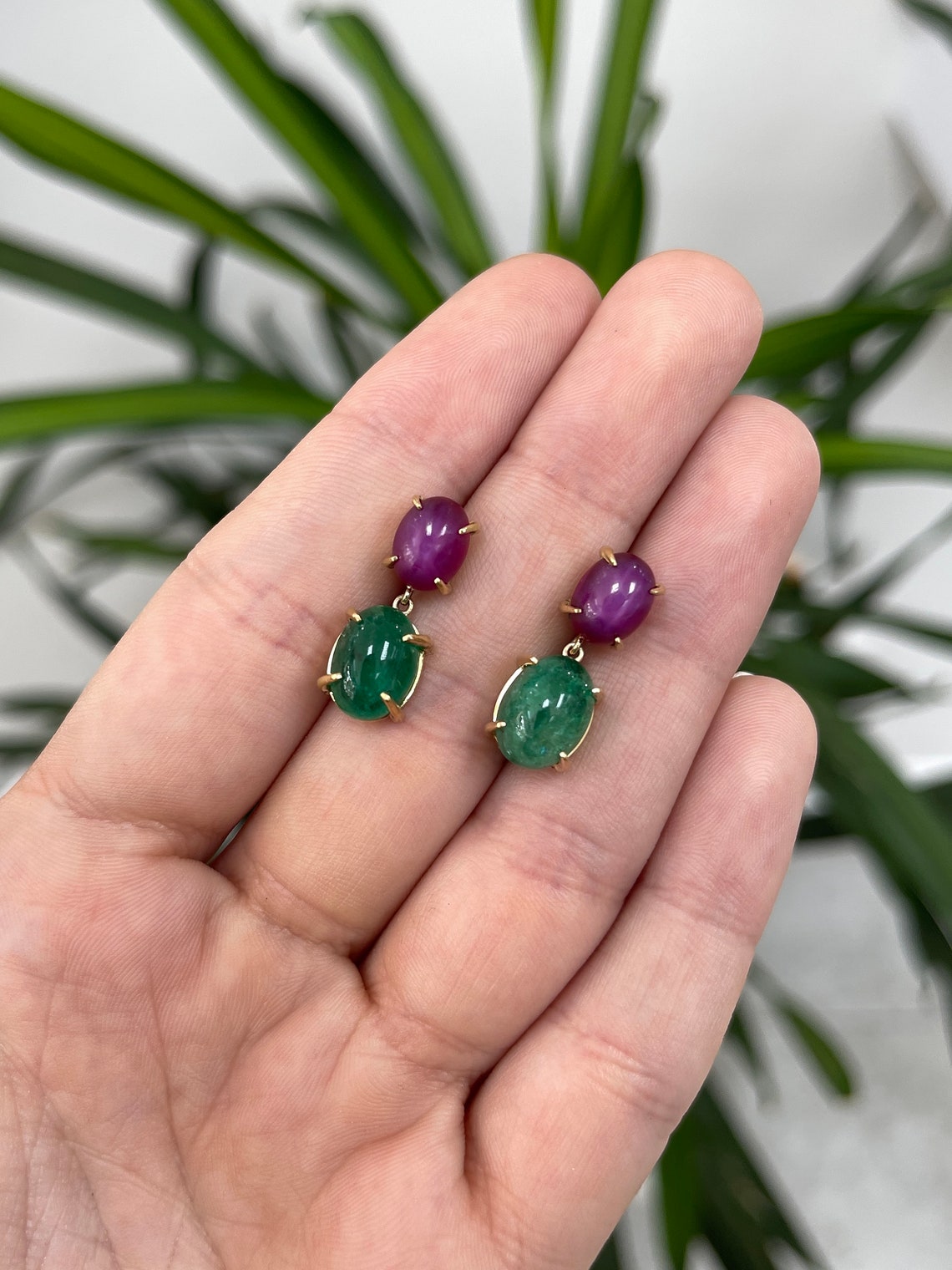 18K gold dangle earrings with natural emerald cabochons and 6-ray star ruby accents, featuring Colombian Emerald brand design