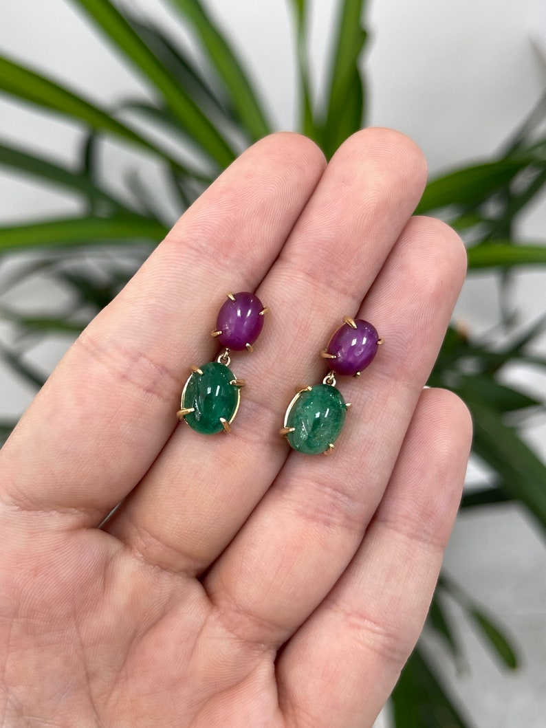 18K gold earrings featuring 13.82tcw natural emerald cabochon and 6-ray star ruby dangles by Colombian Emerald