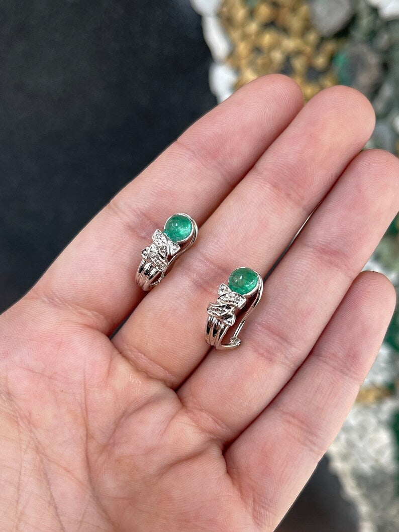 Colombian Emerald 14K gold drop earrings with cabochon emeralds and diamond accents featuring omega hook design.