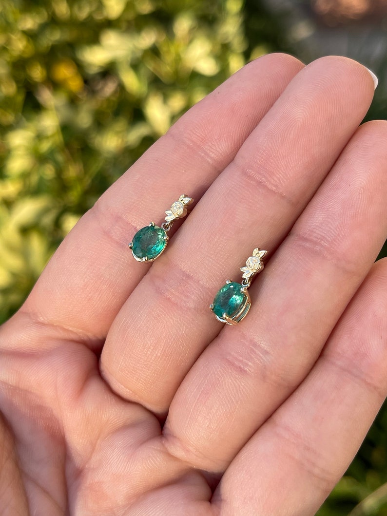Colombian Emerald 14K gold floral dangle earrings with oval cut green and rose natural emeralds, showcasing elegant jewelry design.