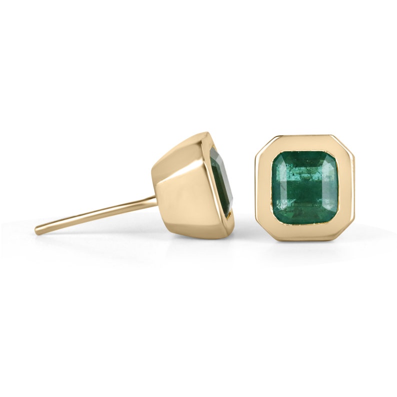 Colombian Emerald earrings with dark vivid green top emeralds in 14K yellow gold bezel setting, stud style.