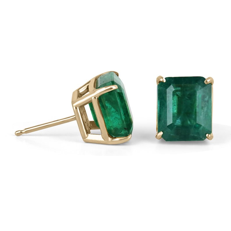 Natural large Colombian emerald stud earrings with a four-prong setting, 18K gold, showcasing fine quality and rare vivid green color.