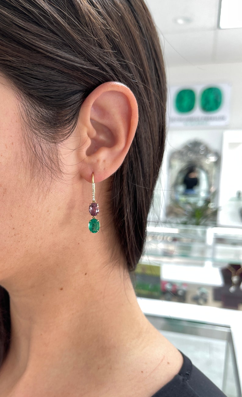 Colombian Emerald 18K gold dangle earrings with vivid green emerald spinel and pave diamond accents, hook drop design.