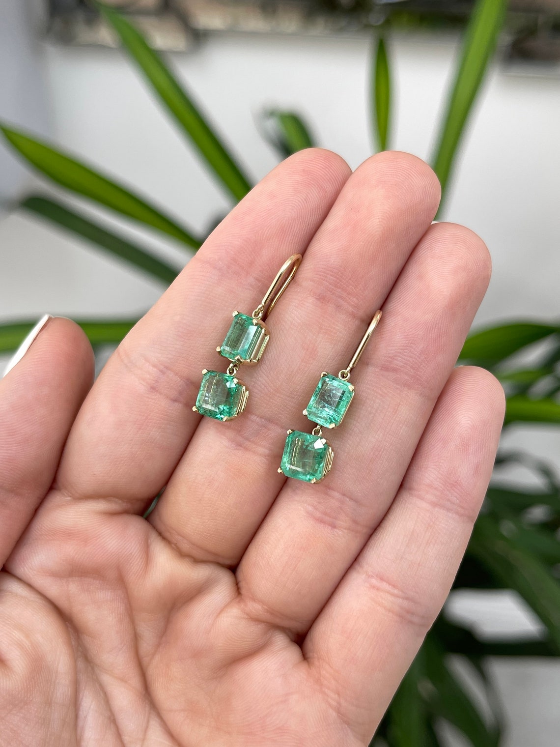 Colombian Emerald 14K gold dangle earrings with natural emeralds and Asscher cut gemstones, hook wire design.