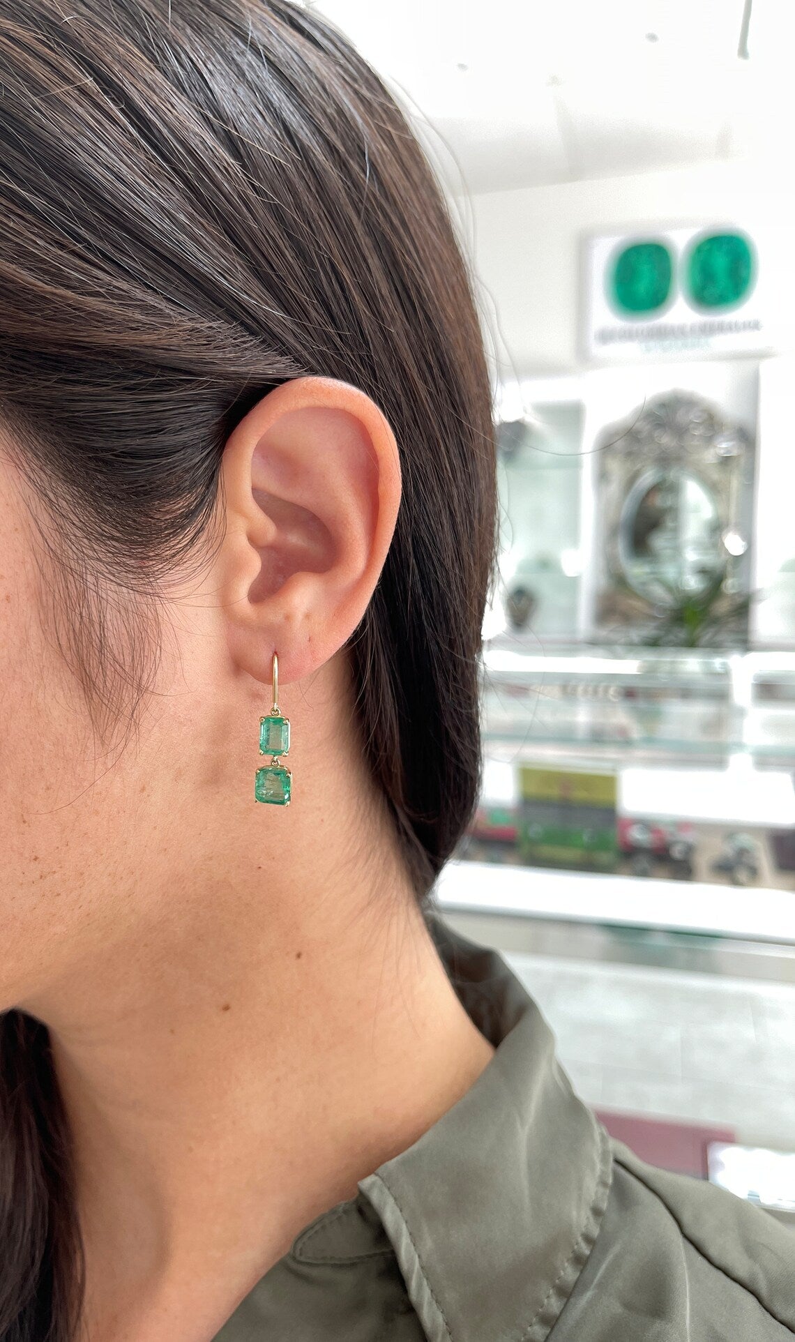 Colombian Emerald 14K gold dangle earrings with natural emeralds and Asscher cut stones on hook wire, elegant jewelry gift