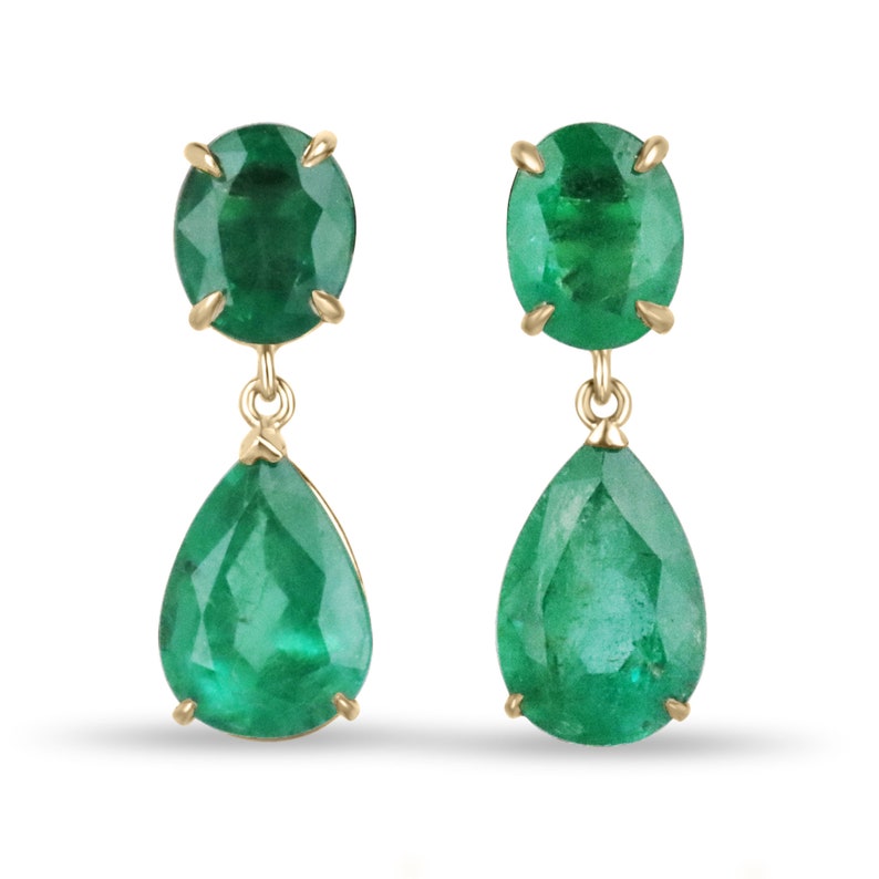Colombian Emerald earrings featuring 9.78tcw dark green oval and pear-shaped dangles in 18K gold with strong, vivacious color.