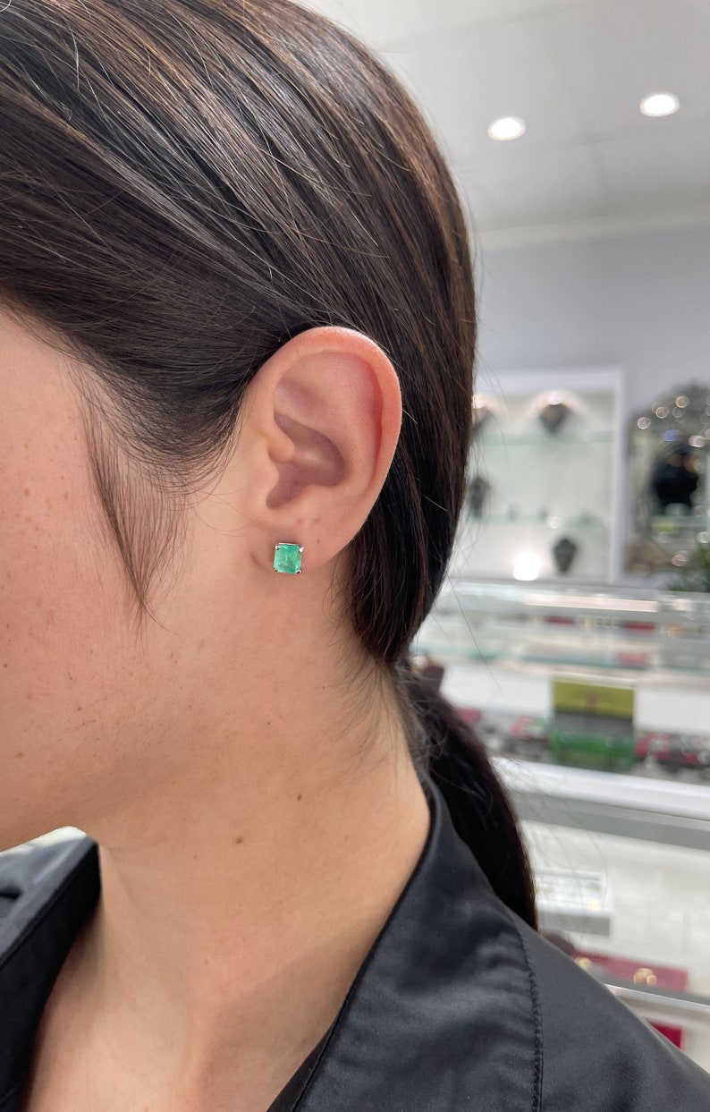 Colombian Emerald Asscher earrings featuring 3.58tcw rare blue sea green emeralds set in 14K gold jewelry