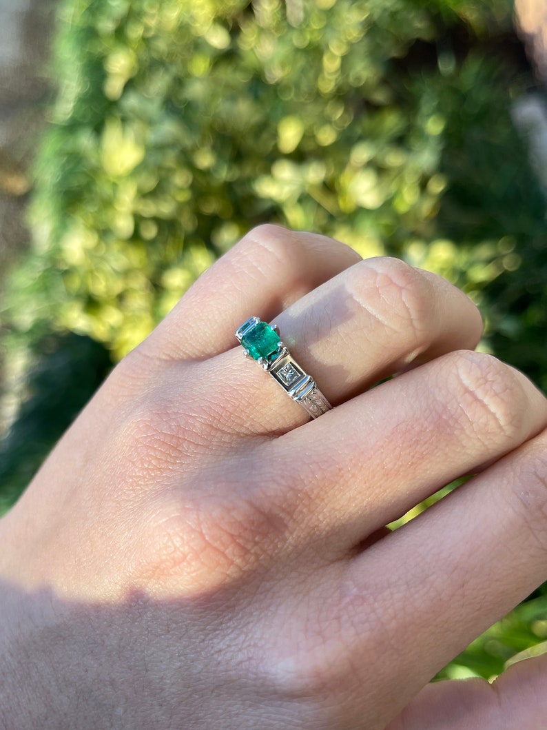 Colombian Emerald 3 stone engagement ring featuring 1.20tcw Asscher and princess cut diamonds in 18K gold setting