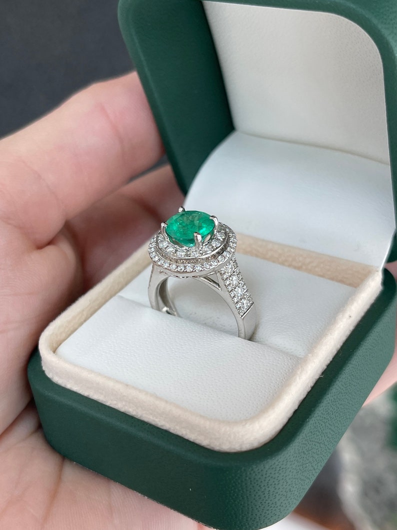 14K white gold emerald engagement ring with double diamond halo and 3.52 tcw Colombian emerald centerpiece.