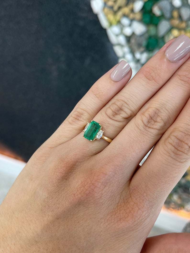 Medium bluish green emerald and marquise cut diamond three-stone engagement ring in 14K gold by Colombian Emerald.