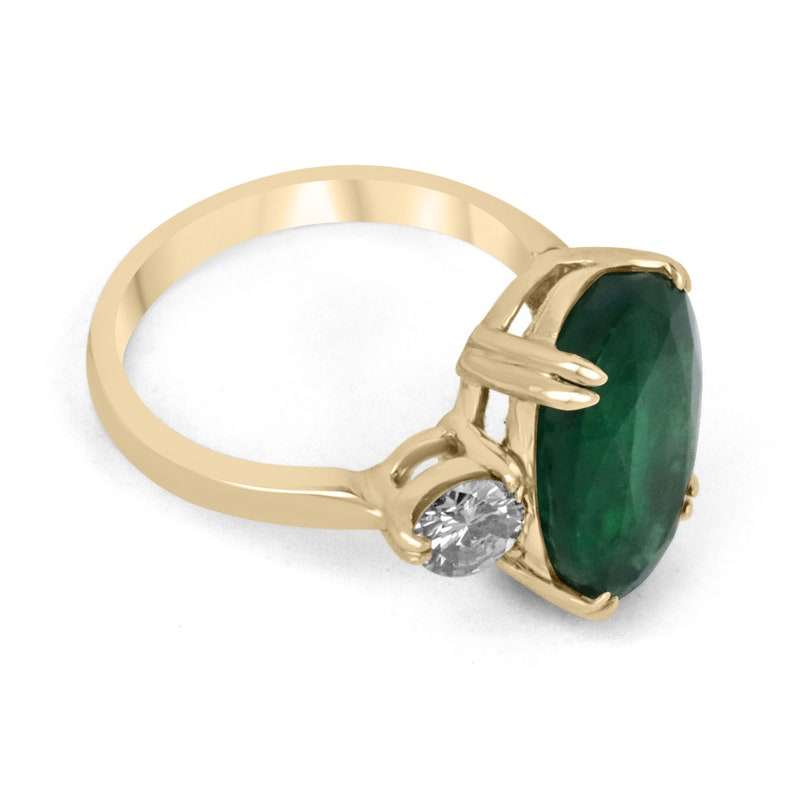 Colombian Emerald 8.39tcw dark green oval emerald and round diamond 3-stone engagement ring in 14K gold, double prong setting.