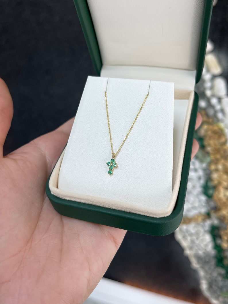 Colombian Emerald 0.15tcw petite round child's baptism cross necklace in 14K yellow gold, religious jewelry for children.