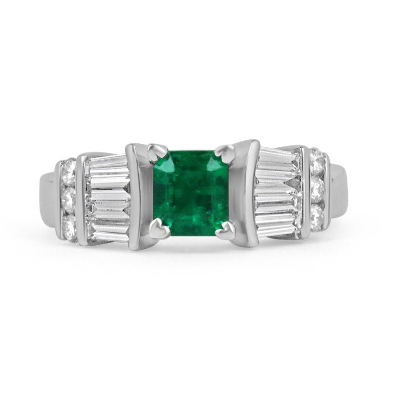 Dark green emerald engagement ring featuring Asscher cut Colombian Emerald with diamond accents in platinum setting.