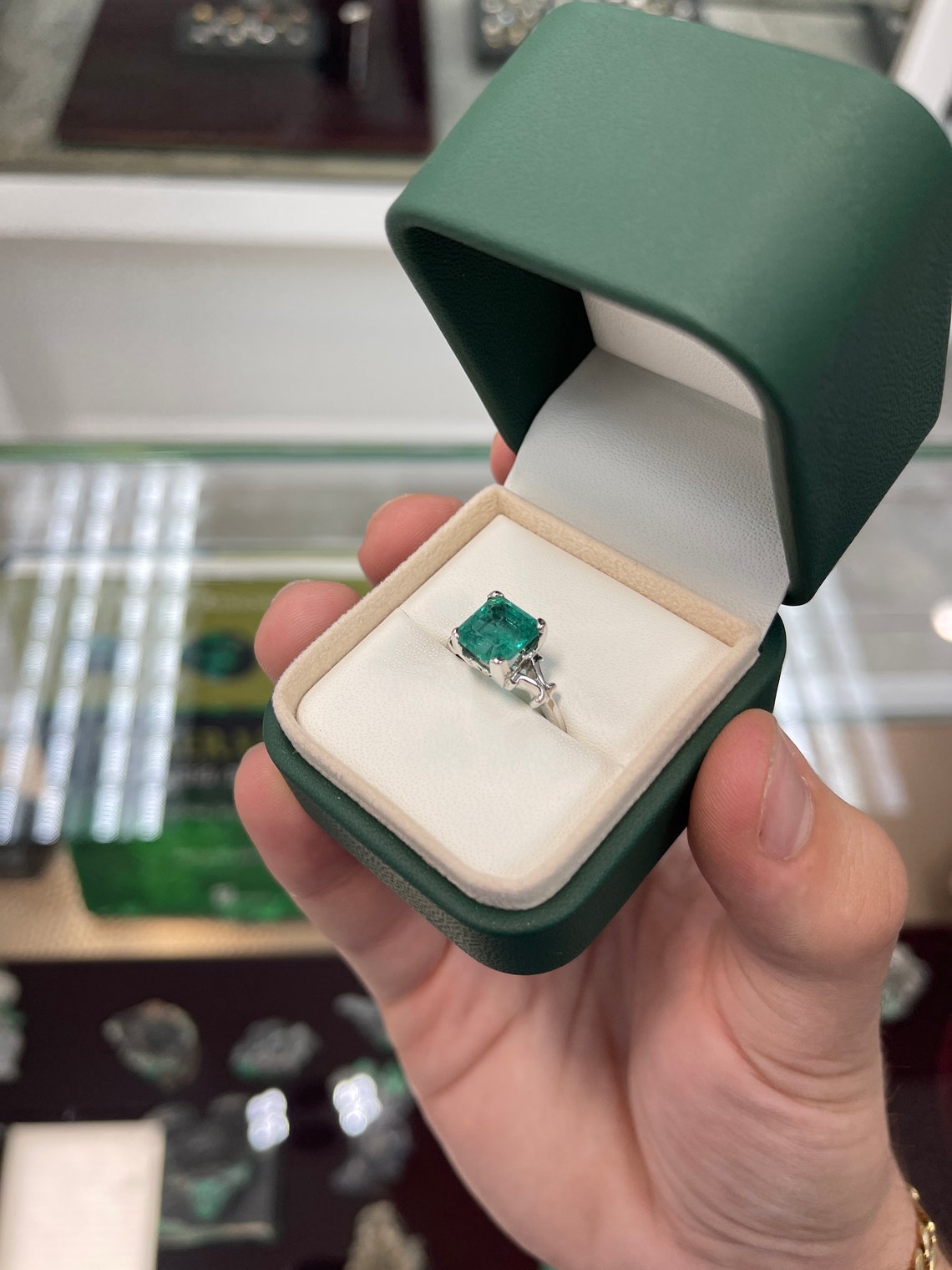 14K white gold engagement ring featuring a 3.25ct rare blue-green Asscher cut emerald with vintage scroll details by Colombian Emerald