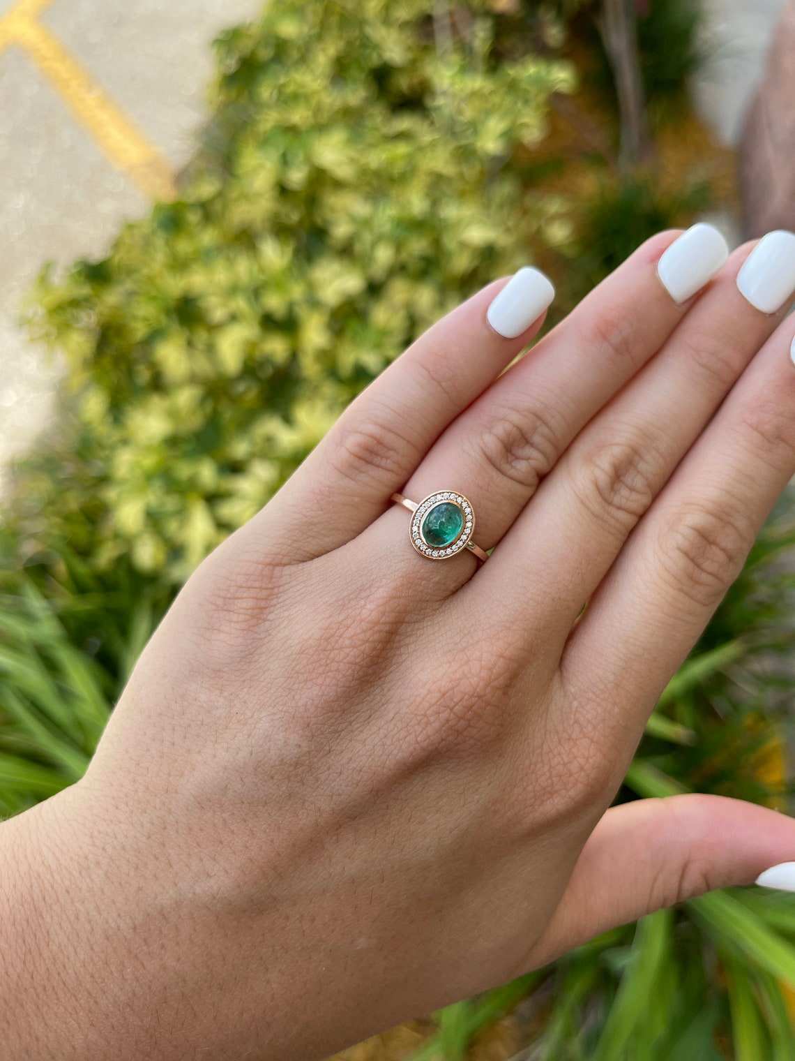 Colombian emerald oval cabochon ladies ring with diamond pave halo, featuring a 1.45tcw real emerald and contemporary design.