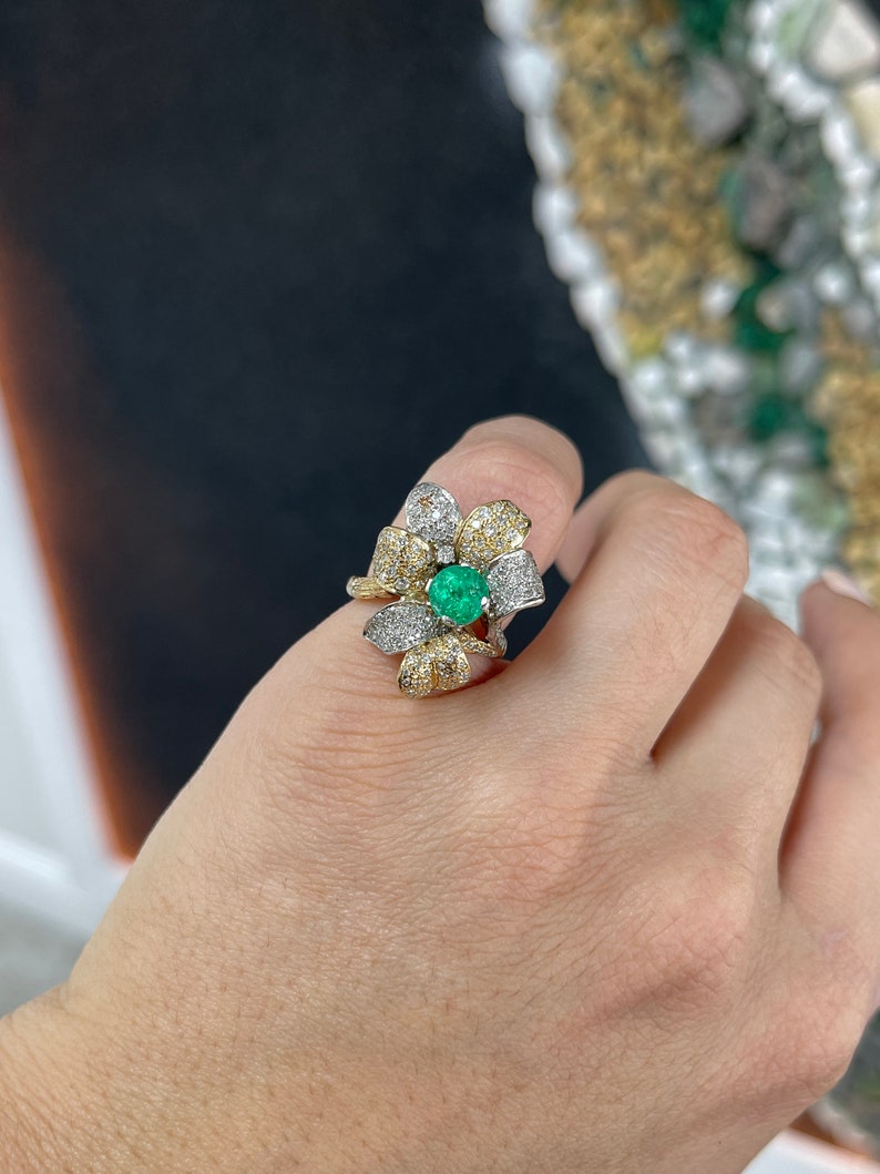 14K gold ladies emerald cluster ring with floral design, round cut emeralds, diamonds, and leaf accents from Colombian Emerald.