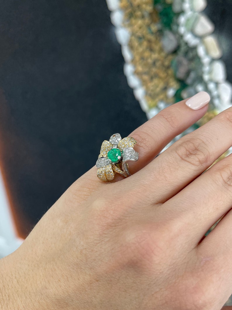 14K gold ladies emerald and diamond cluster floral cocktail ring with round cut stones and leaf design from Colombian Emerald.