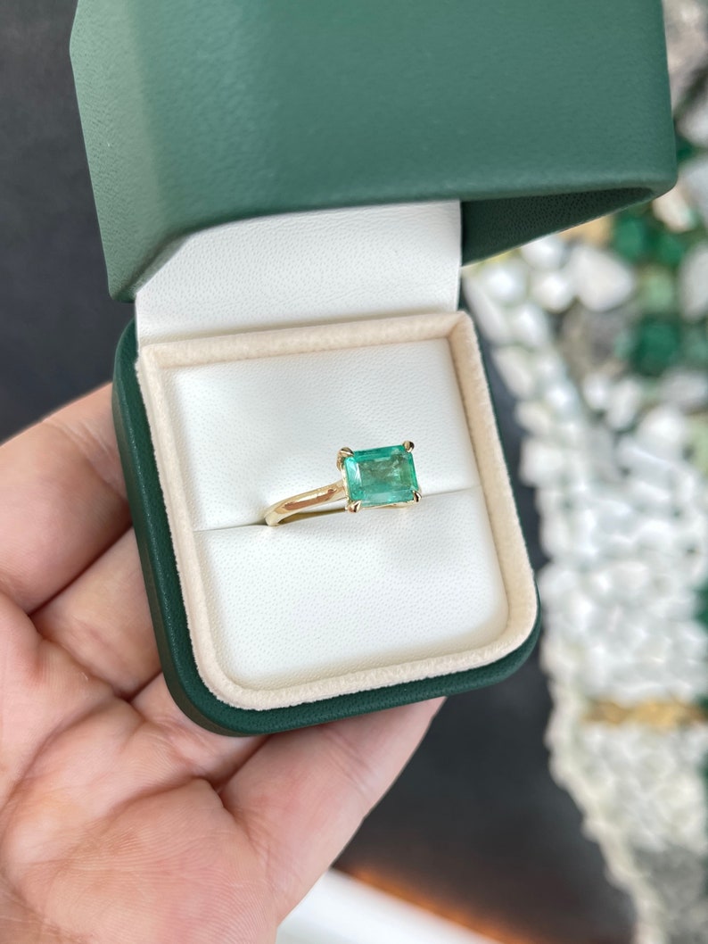 14K gold east-to-west emerald solitaire ring featuring a 2.10 carat Colombian emerald for ladies' right hand jewelry.