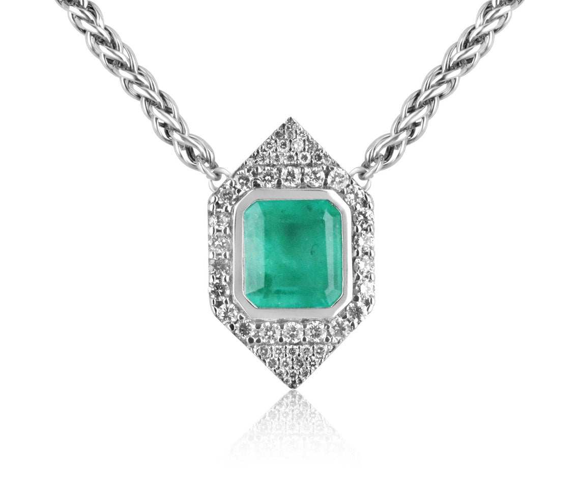 14K white gold Colombian emerald necklace with 8.76ct emerald cut center stone and diamond halo cluster