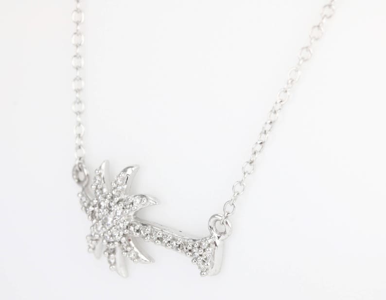 14K gold pendant necklace featuring a 0.25-point natural diamond palm tree design by Colombian Emerald