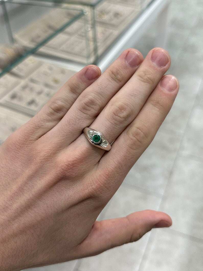 Unisex sterling silver pinky ring with 0.60ct round cut emerald solitaire, Colombian Emerald brand, stylish men's jewelry.