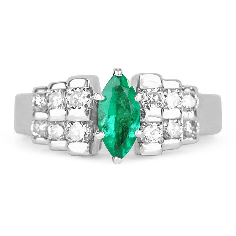 Colombian Emerald and diamond marquise cocktail ring in platinum, semi-transparent with 0.88 carats total weight.