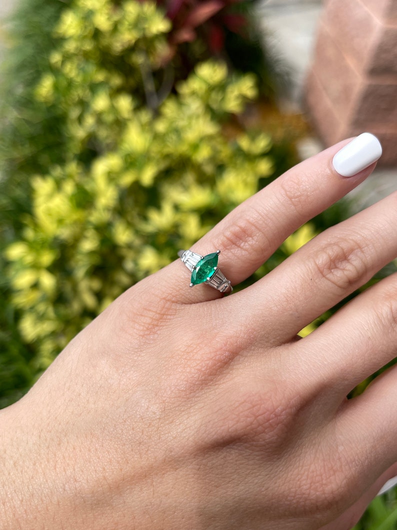 14K Colombian Emerald and diamond ring featuring marquise cut emerald and tapered baguette diamonds, elegant jewelry piece.