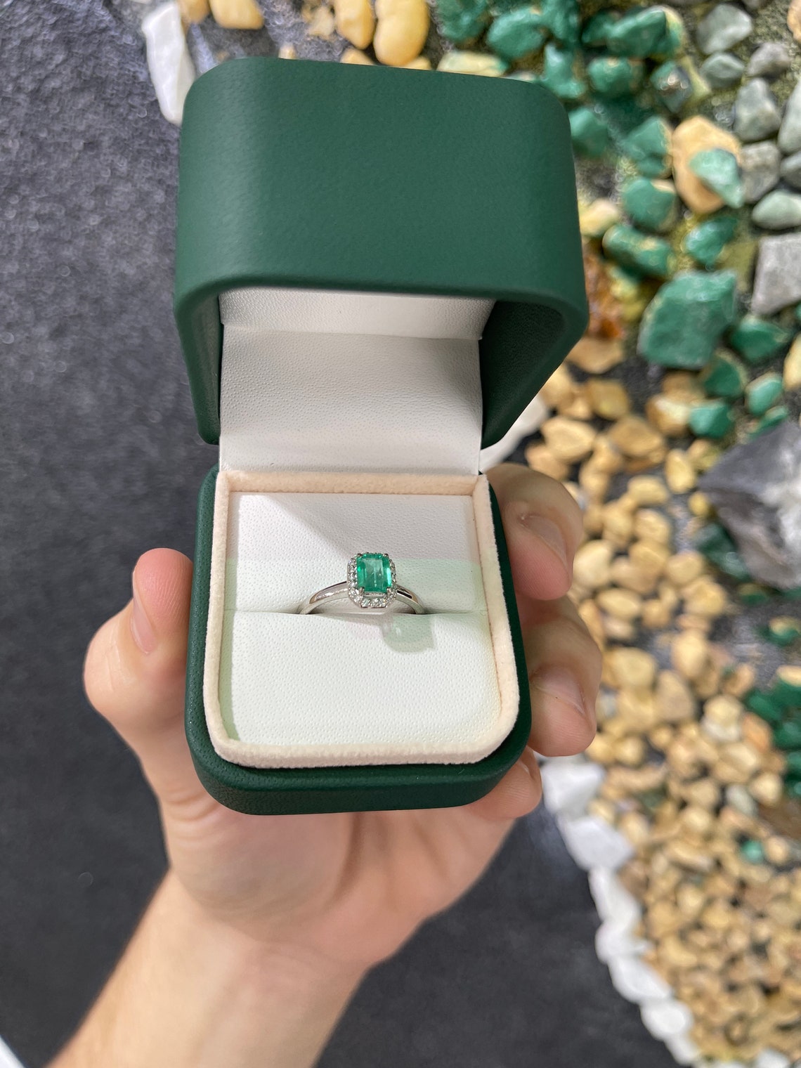 Natural emerald cut engagement ring with diamond halo in 14K gold, featuring a 1.21tcw Colombian Emerald brand jewelry.