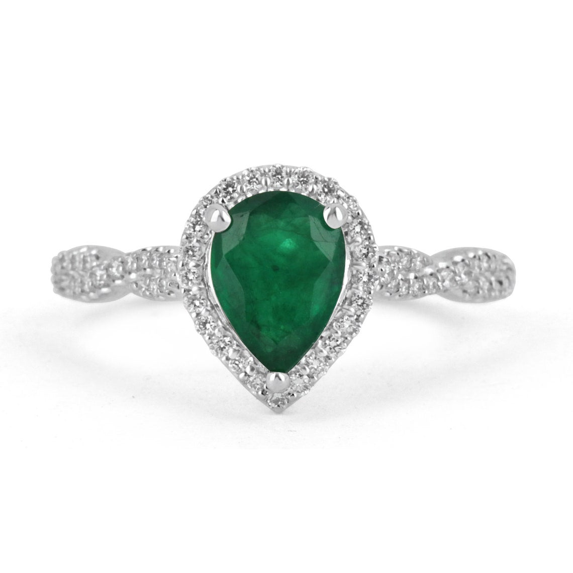 Natural emerald pear-cut engagement ring with diamond halo accents in 14K gold by Colombian Emerald.