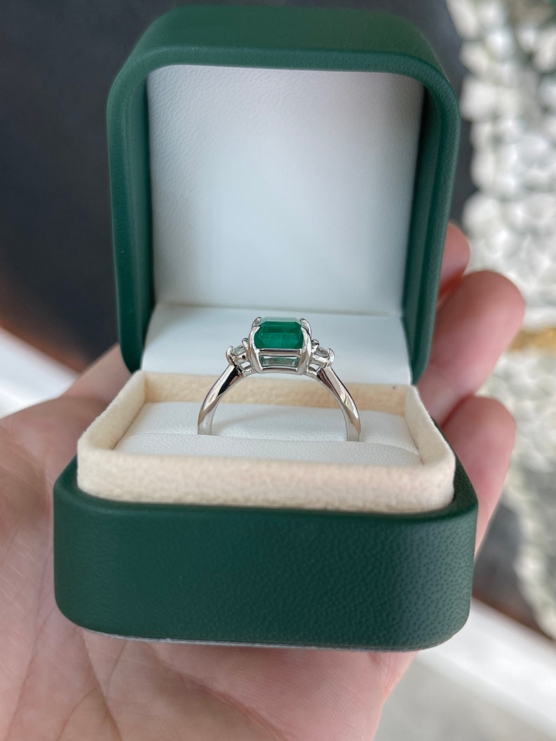 Dark green genuine emerald asscher cut and diamond three-stone engagement ring in 14K gold by Colombian Emerald.