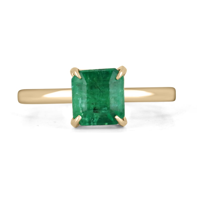 14K gold solitaire engagement ring with a 2.65ct emerald cut Colombian emerald, classic style, elegant and timeless design.