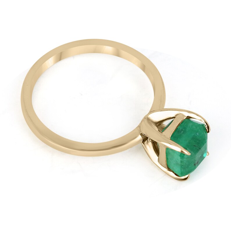14K gold emerald cut solitaire engagement ring with a 2.65 carat Colombian emerald gemstone, classic and elegant design.