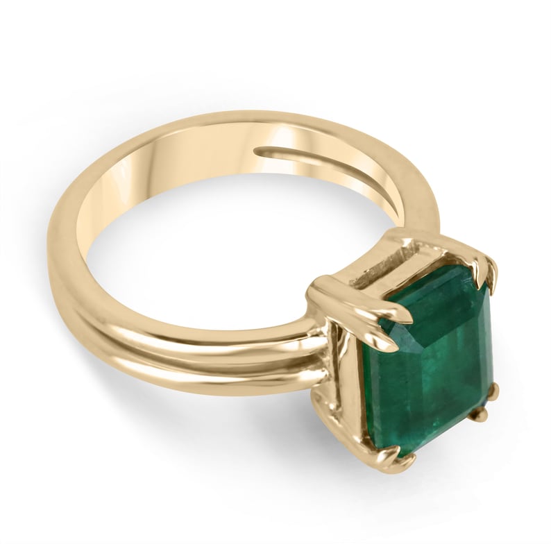 Colombian Emerald 3.28ct gold ring with deep dark green emerald cut gemstone in four-prong solitaire setting