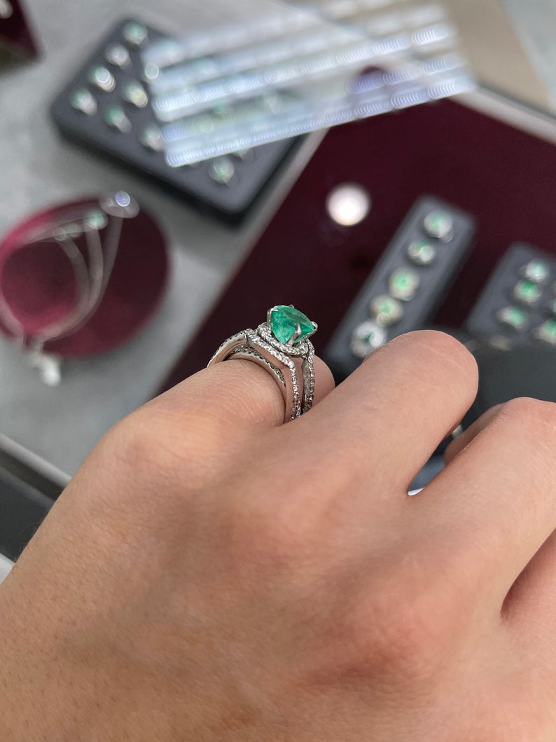 14K Colombian Emerald and diamond halo engagement ring with round cut emerald and sparkling accents, crafted by Colombian Emerald.