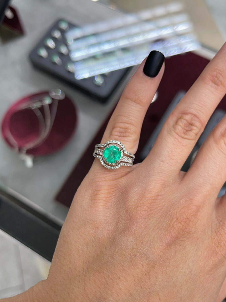 14K Colombian Emerald and diamond halo engagement ring with round cut emerald, 3.40 tcw, featuring intricate band detailing
