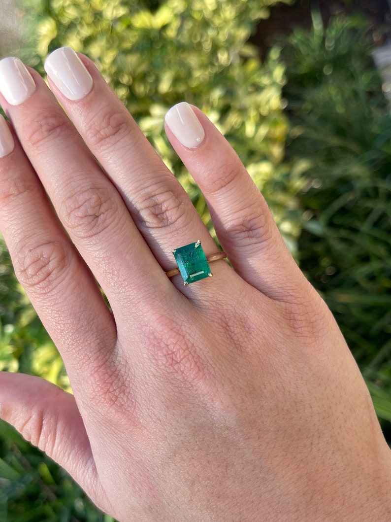 18K gold emerald cut solitaire engagement ring with a 3.84 carat Colombian Emerald, elegant and classic jewelry design